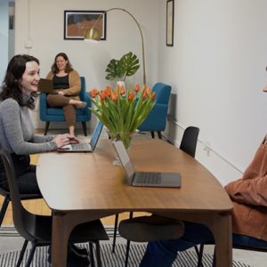 R3 colleagues working at table
